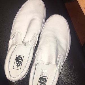 All white slip on Vans